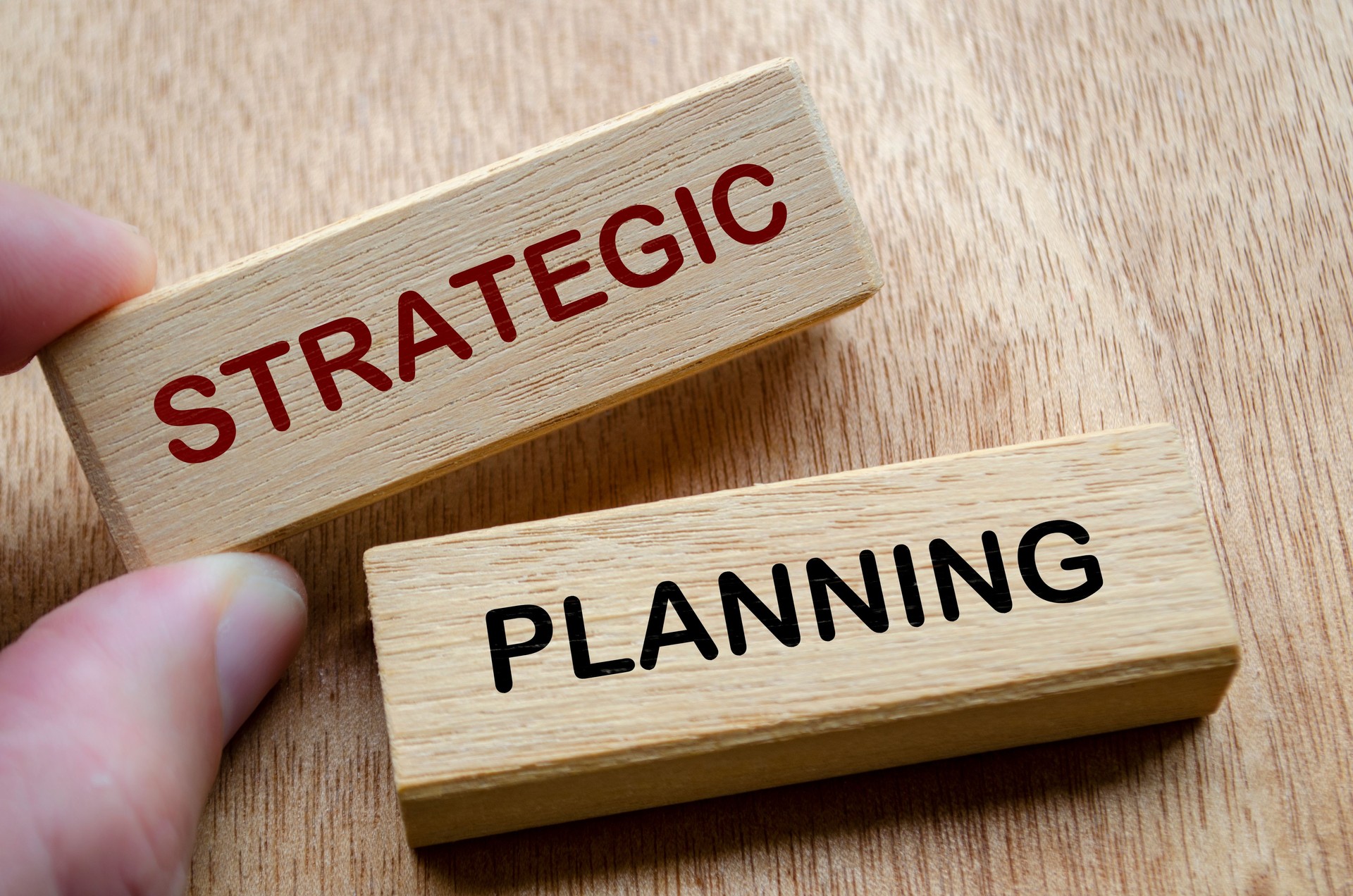 Strategic Planning text on wooden blocks. Business planning strategy concept.
